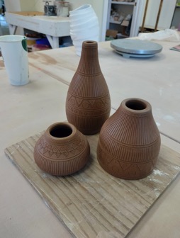 Three pictorial vases